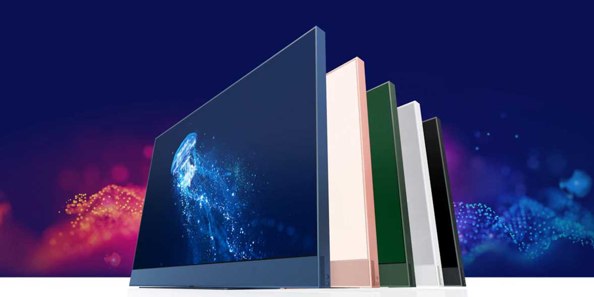 Five sleek computer monitors in varying colors, featuring vibrant display graphics against a colorful background.