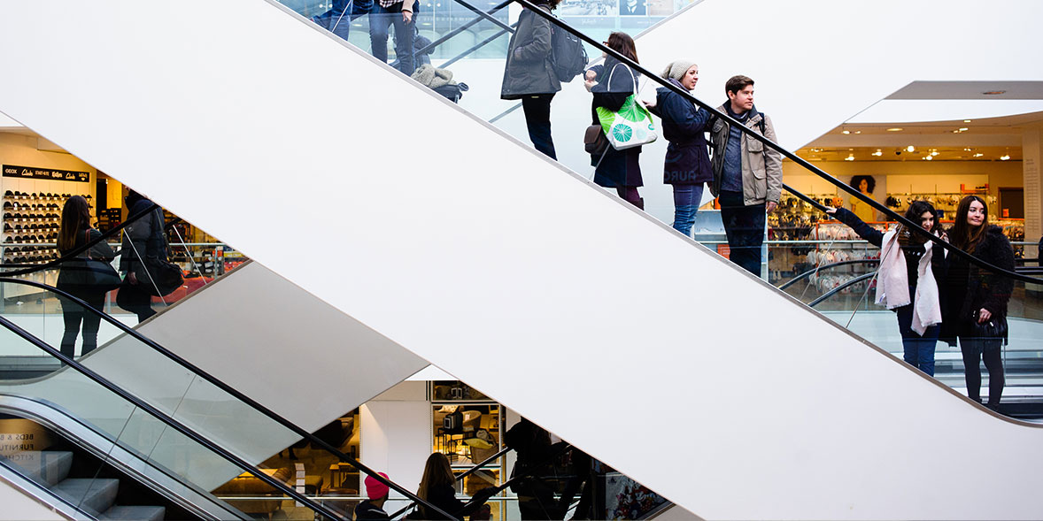 Shoppers on escalators in John Lewis