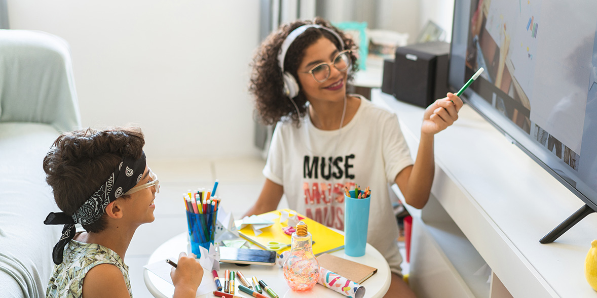 Two young adults engage in art and crafts
